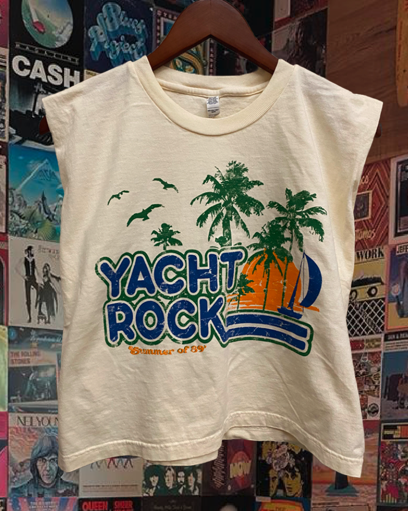 Beige sleeveless shirt with 'Yacht Rock' graphic design on a background of vintage records and posters.
