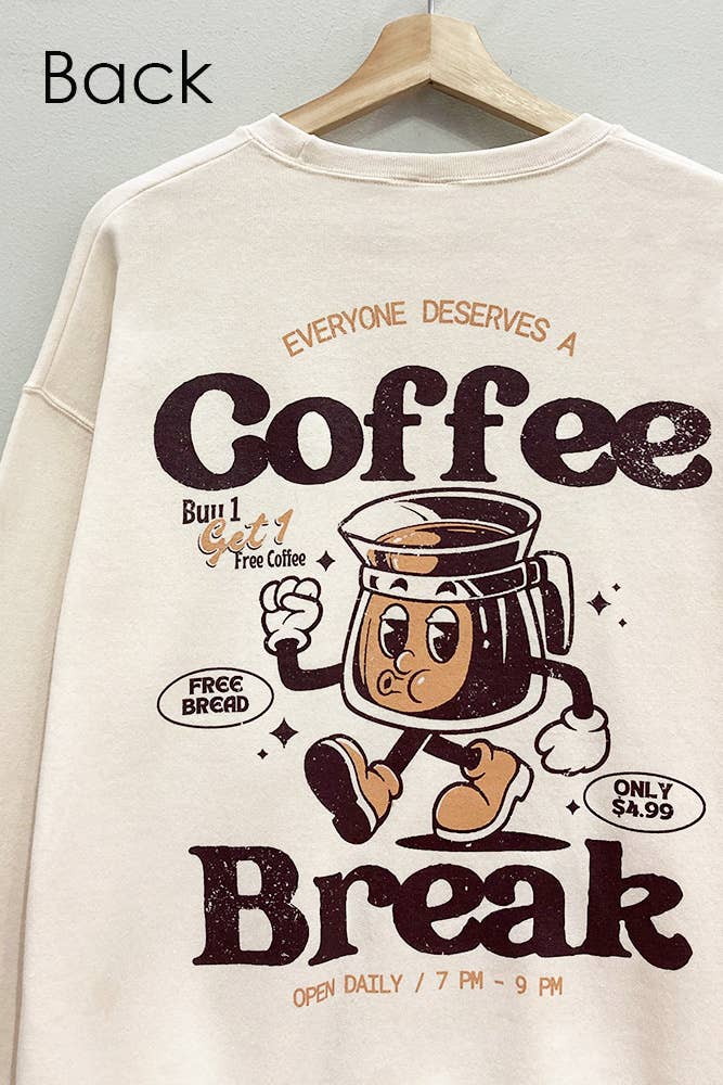 Beige sweatshirt with cartoon coffee cup character and text on a hanger