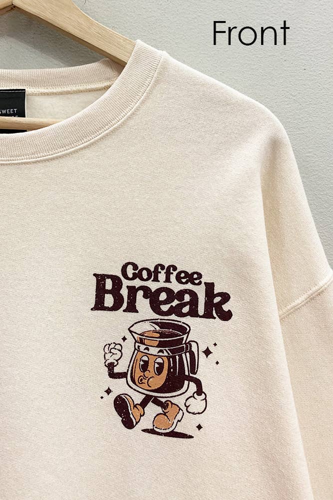 Beige sweatshirt with 'Coffee Break' graphic on a hanger against a gray background