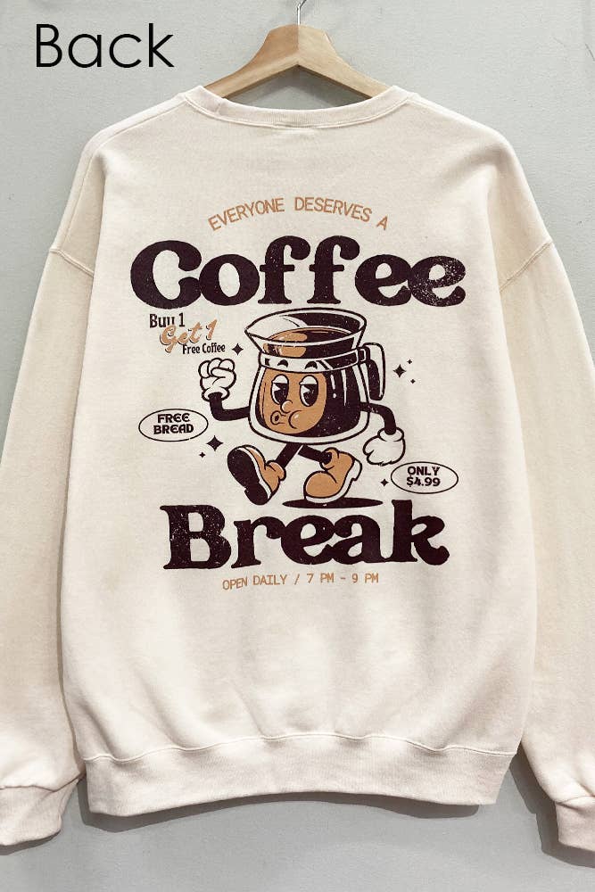 Beige sweatshirt with coffee-themed graphic on a hanger against a gray background