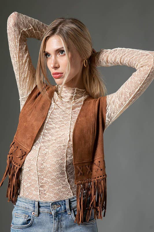 lady wearing lace top with vest