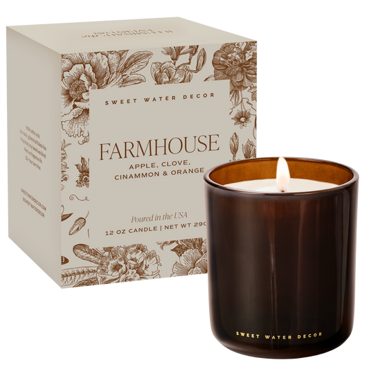 Farmhouse-themed candle with packaging featuring floral designs and 'Sweet Water Decor' branding.