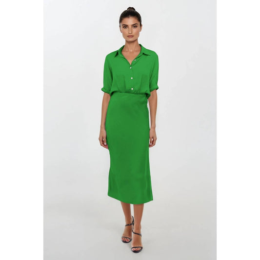 Woman wearing a green dress on a white background