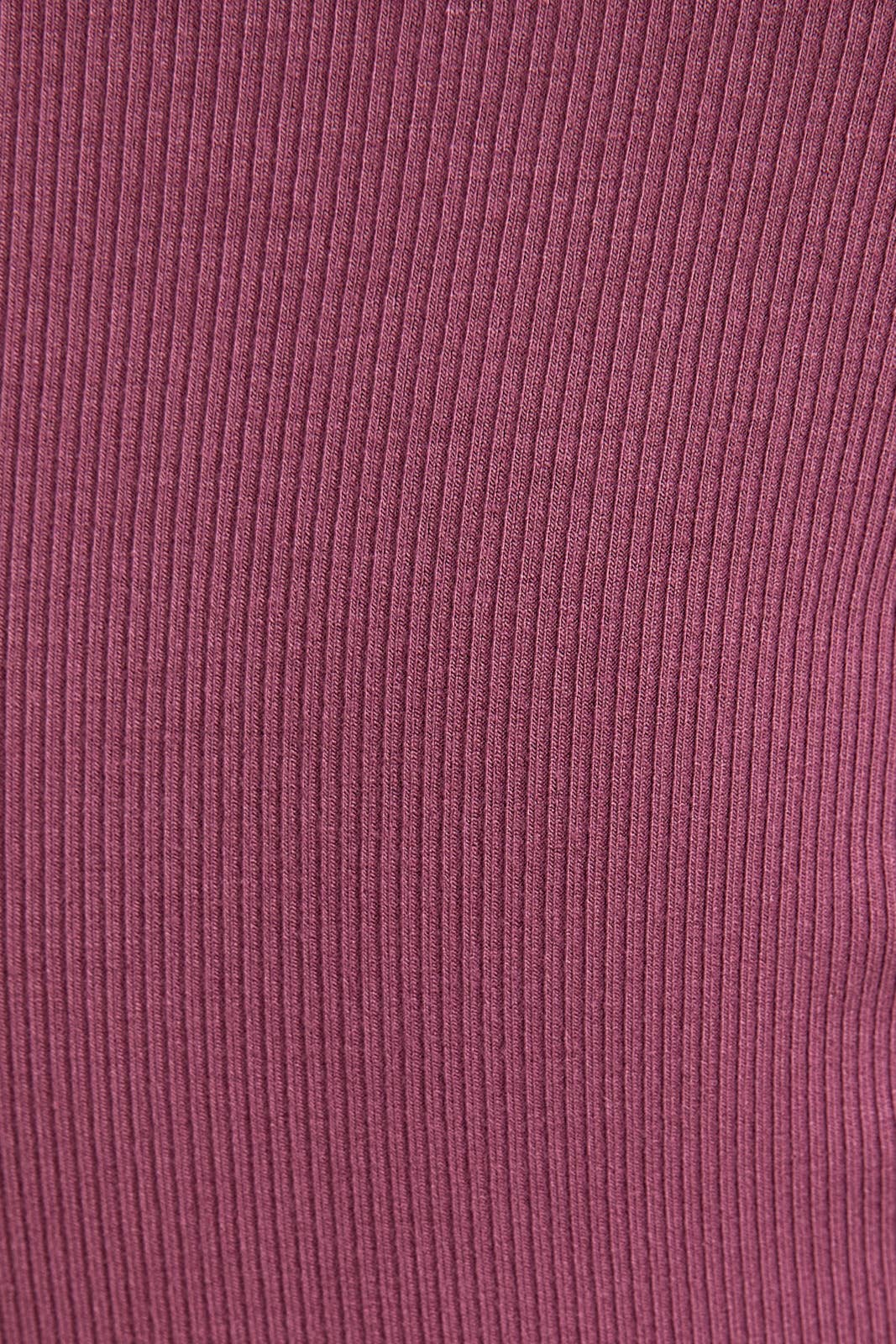 Close-up of ribbed fabric in a purple color