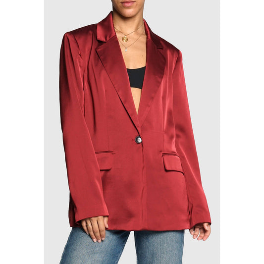 Red satin blazer worn by a person on a plain background